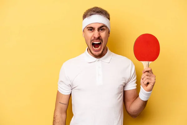 Young Caucasian Man Holding Ping Pong Rackets Isolated Yellow Background — 스톡 사진
