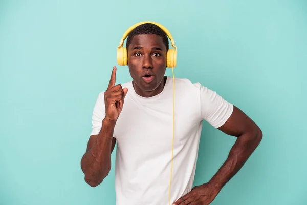 Young African American Man Listening Music Isolated Blue Background Having — Stock Photo, Image