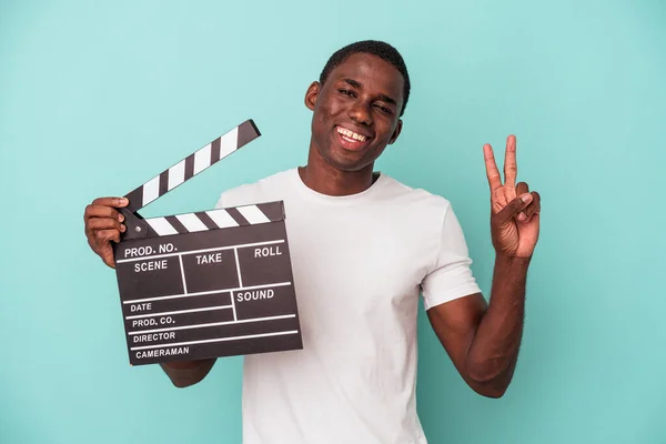 Young African American Man Holding Clapperboard Isolated Blue Background Joyful — Stock Photo, Image