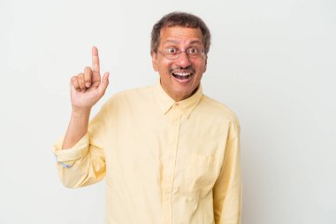 Middle aged indian man isolated on white background having an idea, inspiration concept.