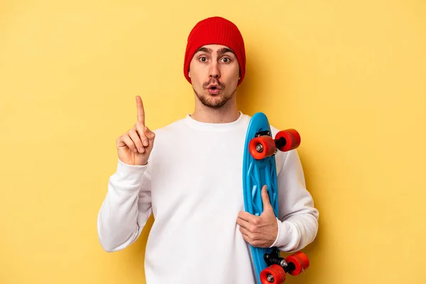 Young Skater Caucasian Man Isolated Yellow Background Having Some Great — Stockfoto