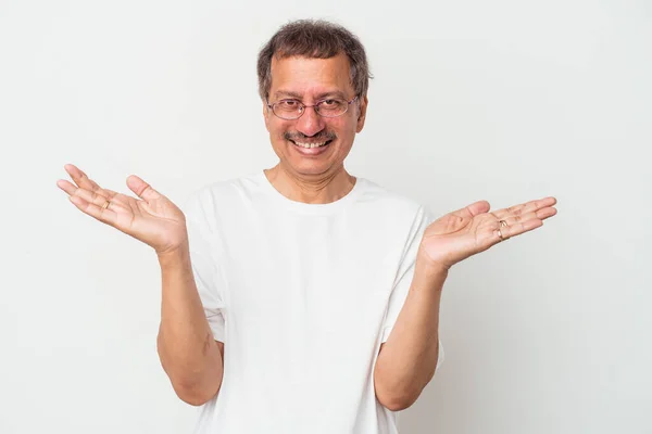 Middle Aged Indian Man Isolated White Background Makes Scale Arms —  Fotos de Stock