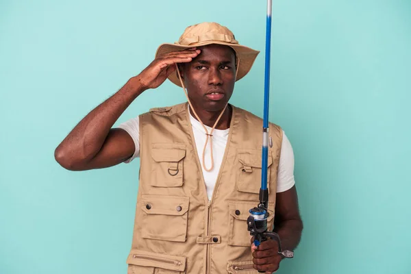 Young African American Fisherman Holding Rod Isolated Blue Background Being — Stock Photo, Image