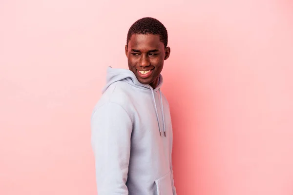 Young African American Man Isolated Pink Background Looks Aside Smiling — Stock Photo, Image