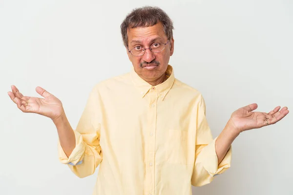 Middle Aged Indian Man Isolated White Background Doubting Shrugging Shoulders — Fotografia de Stock