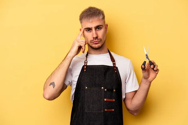 Young Caucasian Hairdresser Man Holding Scissors Isolated Yellow Background Pointing — Stock fotografie