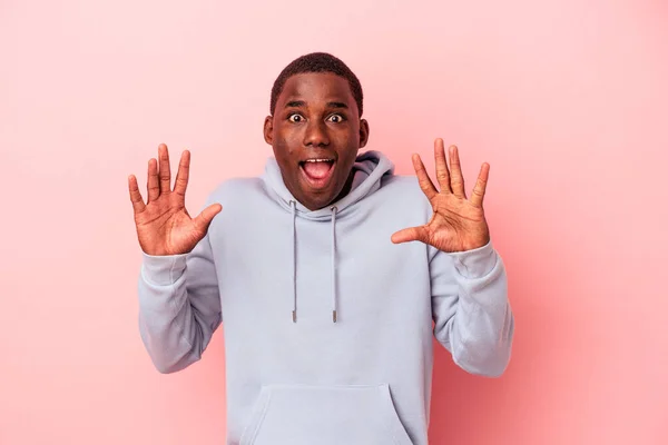 Young African American Man Isolated Pink Background Receiving Pleasant Surprise — Stock Photo, Image
