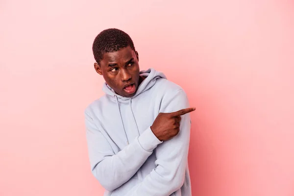 Young African American Man Isolated Pink Background Points Thumb Finger — Stock Photo, Image