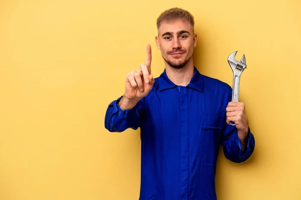Young Electrician Caucasian Man Isolated Yellow Background Showing Number One — Stockfoto