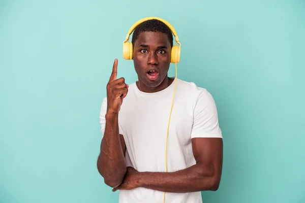 Young African American Man Listening Music Isolated Blue Background Having — ストック写真