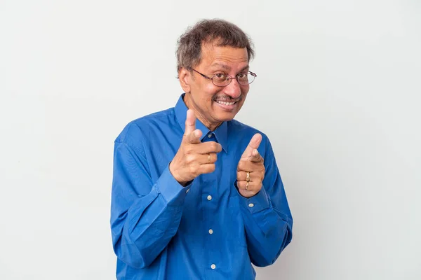 Middle aged indian man isolated on white background pointing to front with fingers.