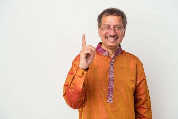 Senior indian man wearing a Indian costume isolated on white background showing number one with finger.