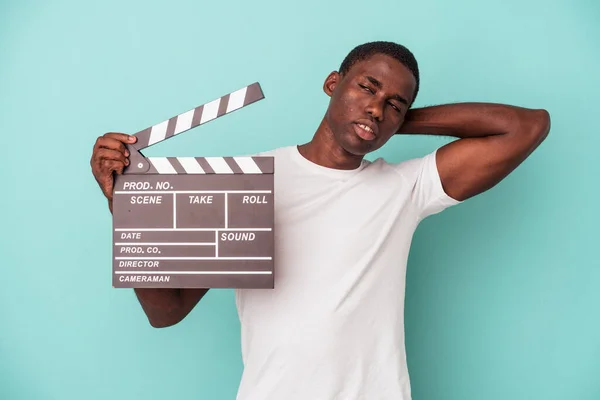 Young African American Man Holding Clapperboard Isolated Blue Background Touching — Stock Photo, Image