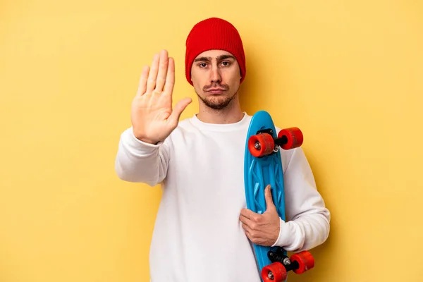 Young Skater Caucasian Man Isolated Yellow Background Standing Outstretched Hand — 图库照片