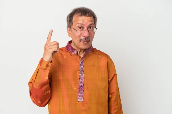 Senior indian man wearing a Indian costume isolated on white background having some great idea, concept of creativity.