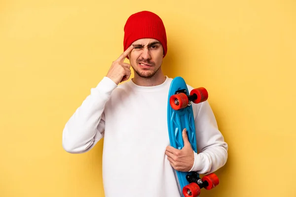 Young Skater Caucasian Man Isolated Yellow Background Showing Disappointment Gesture — Fotografia de Stock