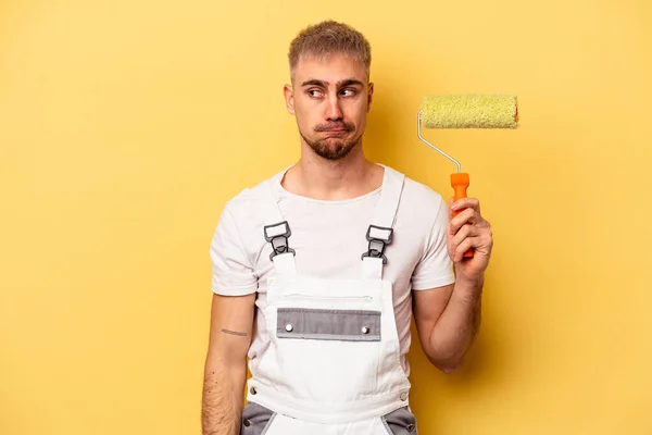 Young Painter Man Isolated Yellow Background Confused Feels Doubtful Unsure — 图库照片