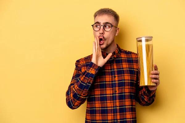 Young Caucasian Man Holding Spaghettis Jar Isolated Yellow Background Saying — Stock fotografie