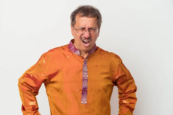 Senior indian man wearing a Indian costume isolated on white background screaming very angry and aggressive.