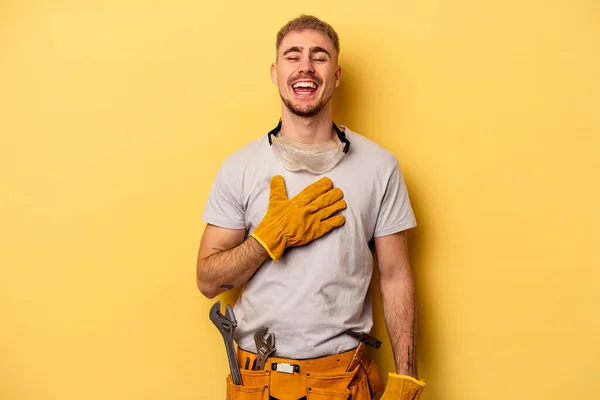 Young Electrician Caucasian Man Isolated Yellow Background Laughs Out Loudly — 스톡 사진