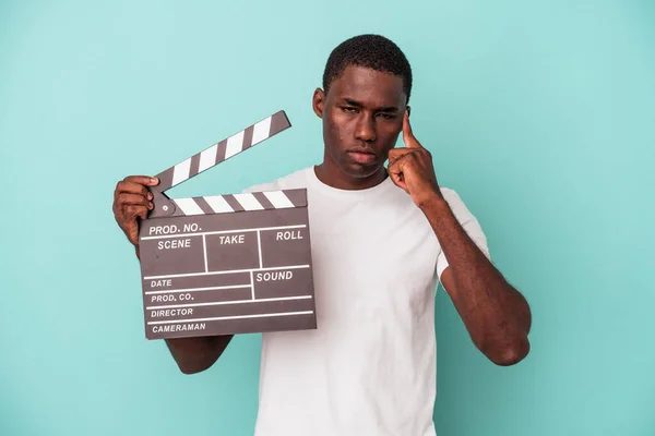 Young African American Man Holding Clapperboard Isolated Blue Background Pointing — Stock Photo, Image
