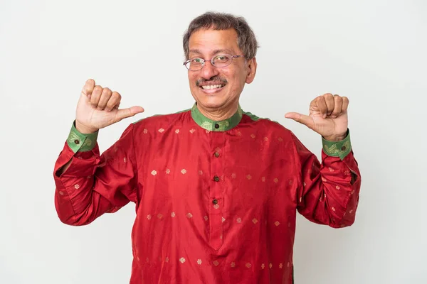 Senior indian man wearing a Indian costume isolated on white background feels proud and self confident, example to follow.