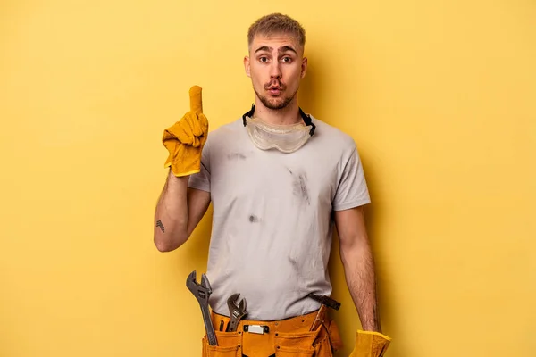Young Electrician Caucasian Man Isolated Yellow Background Having Some Great — Zdjęcie stockowe