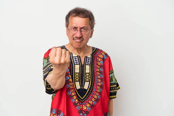 Senior indian man wearing a Indian costume isolated on white background showing fist to camera, aggressive facial expression.