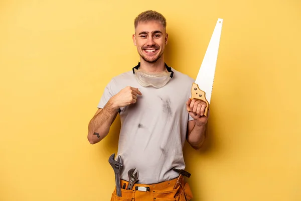 Young Electrician Caucasian Man Isolated Yellow Background Person Pointing Hand — Stockfoto