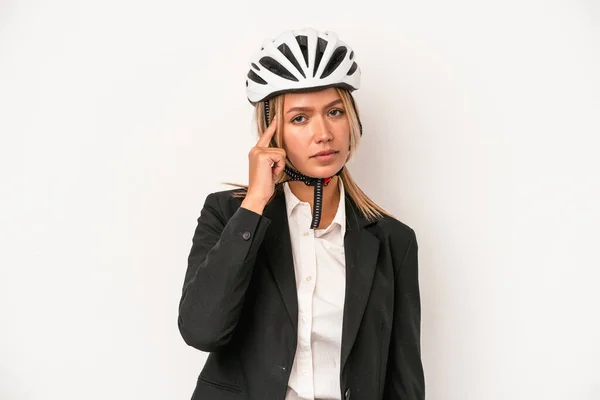 Young caucasian business woman wearing a bike helmet isolated on white background pointing temple with finger, thinking, focused on a task.