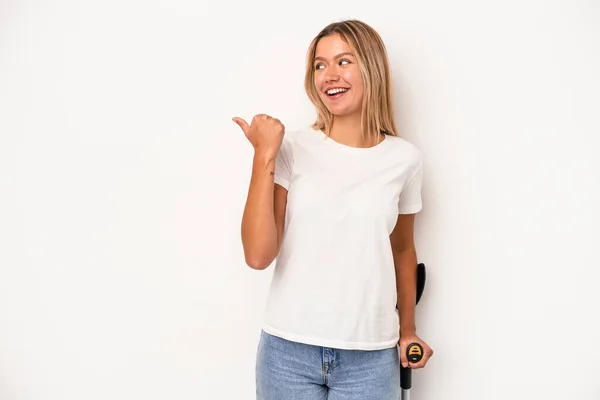 Young Caucasian Woman Holding Crutch Isolated White Background Points Thumb — Stok fotoğraf