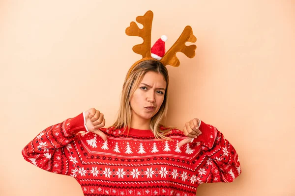 Young Caucasian Woman Wearing Christmas Reindeer Hat Isolated Beige Background —  Fotos de Stock