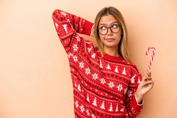 Young Caucasian Woman Holding Christmas Stick Isolated Beige Background Touching — Fotografia de Stock