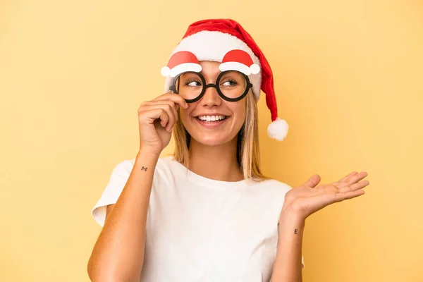 Young Caucasian Woman Holding Christmas Props Isolated Yellow Background — Foto de Stock