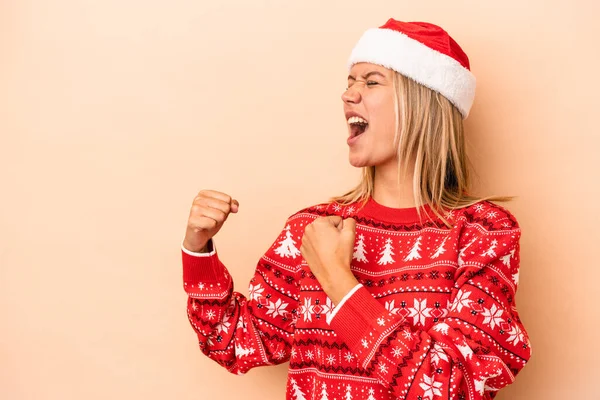 Young Caucasian Woman Celebrating Christmas Isolated Beige Background Raising Fist — 图库照片