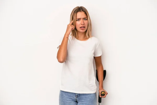 Young Caucasian Woman Holding Crutch Isolated White Background Showing Disappointment — Stok fotoğraf