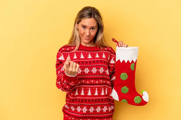 Young Caucasian Woman Holding Elf Sock Isolated Yellow Background Pointing — Stock Photo, Image