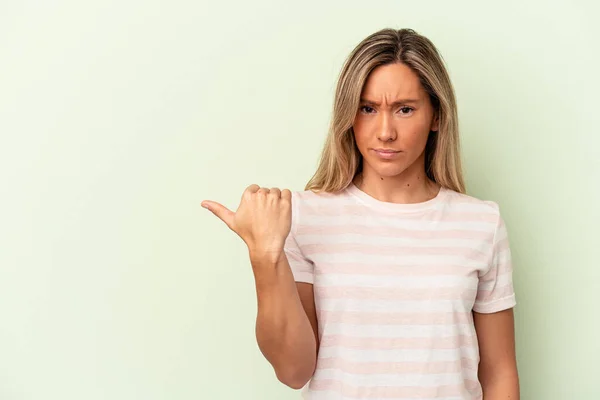 Young Caucasian Woman Isolated Green Background Shocked Pointing Index Fingers — Stock Photo, Image