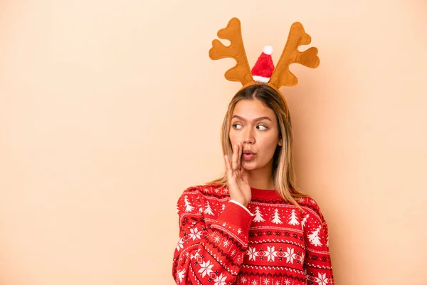 Young Caucasian Woman Wearing Christmas Reindeer Hat Isolated Beige Background — Stok fotoğraf