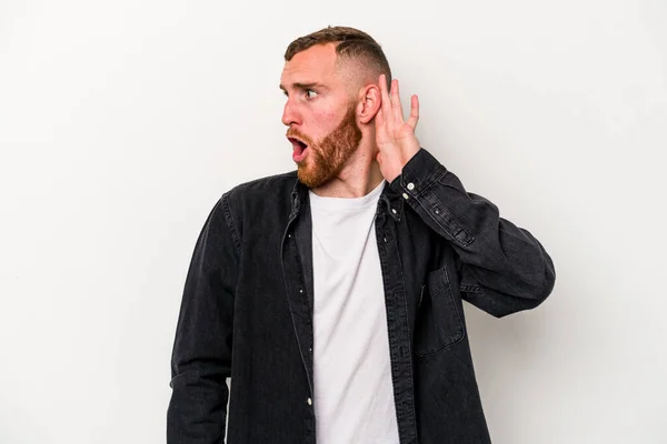 Young Caucasian Man Isolated White Background Trying Listening Gossip — Stock Photo, Image