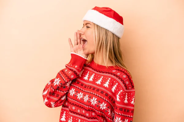 Young Caucasian Woman Celebrating Christmas Isolated Beige Background Shouting Holding — Photo