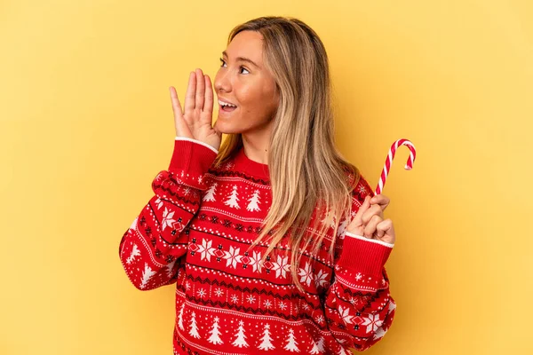 Young Caucasian Woman Holding Christmas Stick Isolated Yellow Background Shouting — Stock Photo, Image