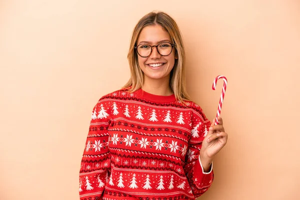 Young Caucasian Woman Holding Christmas Stick Isolated Beige Background Happy — Stok fotoğraf
