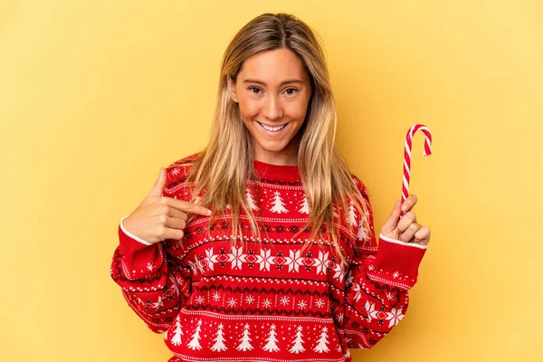 Young Caucasian Woman Holding Christmas Stick Isolated Yellow Background Person — Stock Photo, Image