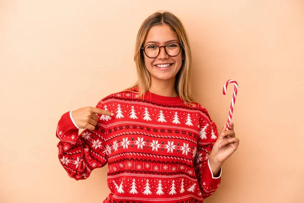 Young Caucasian Woman Holding Christmas Stick Isolated Beige Background Person — Stok fotoğraf
