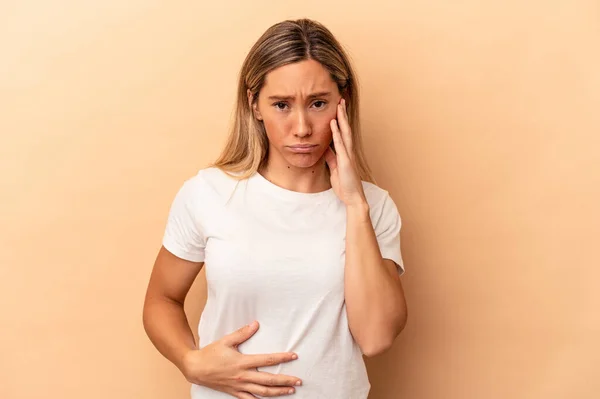 Young Caucasian Woman Isolated Beige Background Blows Cheeks Has Tired — Stock Photo, Image