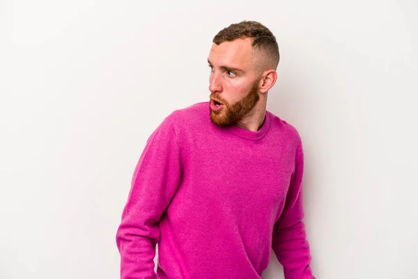 Young Caucasian Man Isolated White Background Looks Aside Smiling Cheerful — Stock Photo, Image