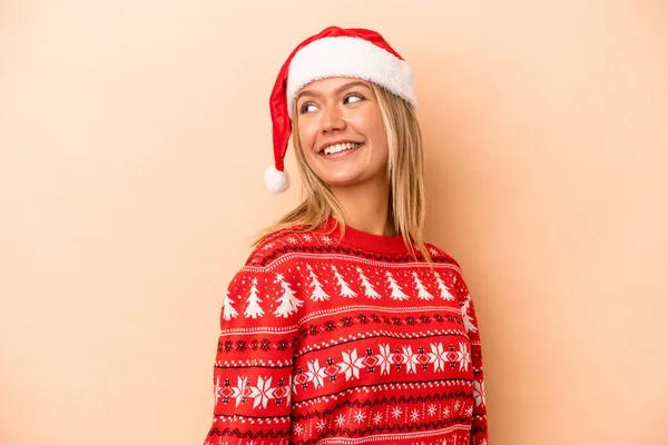 Young Caucasian Woman Celebrating Christmas Isolated Beige Background Looks Aside — Foto Stock