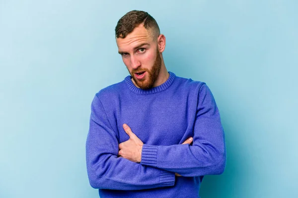 Young Caucasian Man Isolated Blue Background Unhappy Looking Camera Sarcastic — Stock Photo, Image