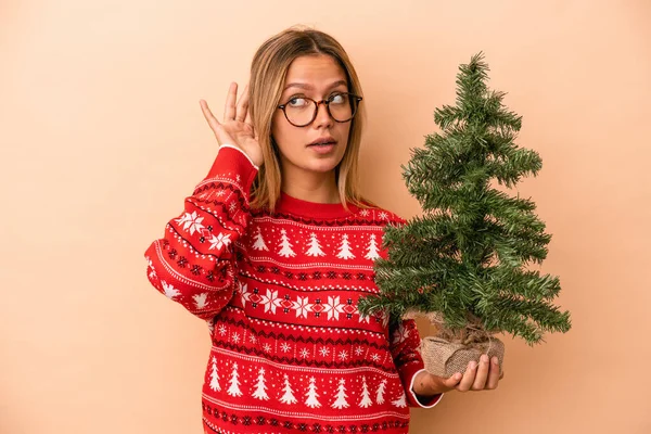Young Caucasian Woman Holding Little Christmas Tree Isolated Beige Background —  Fotos de Stock